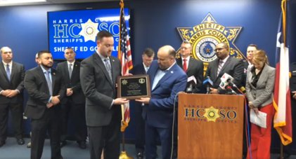 Harris County Sheriff’s Office Sergeant Marty Kuehn presents a plaque to Goose Creek ISD’s administration for the district’s assistance in Operation Kickoff 2020. The school district offered a base of operations for the initiative which capture what HCSO staff termed as one of the most violent human traffickers they’ve encountered.